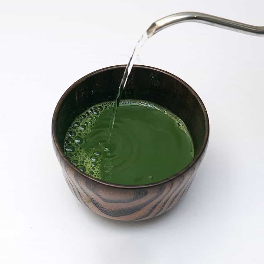 pouring water on matcha