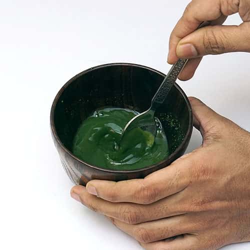 mixing matcha with spoon